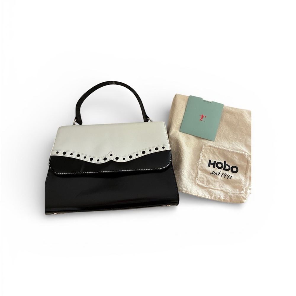 HOBO International Black & White Wing Tip Leather Envelope bag with handle.